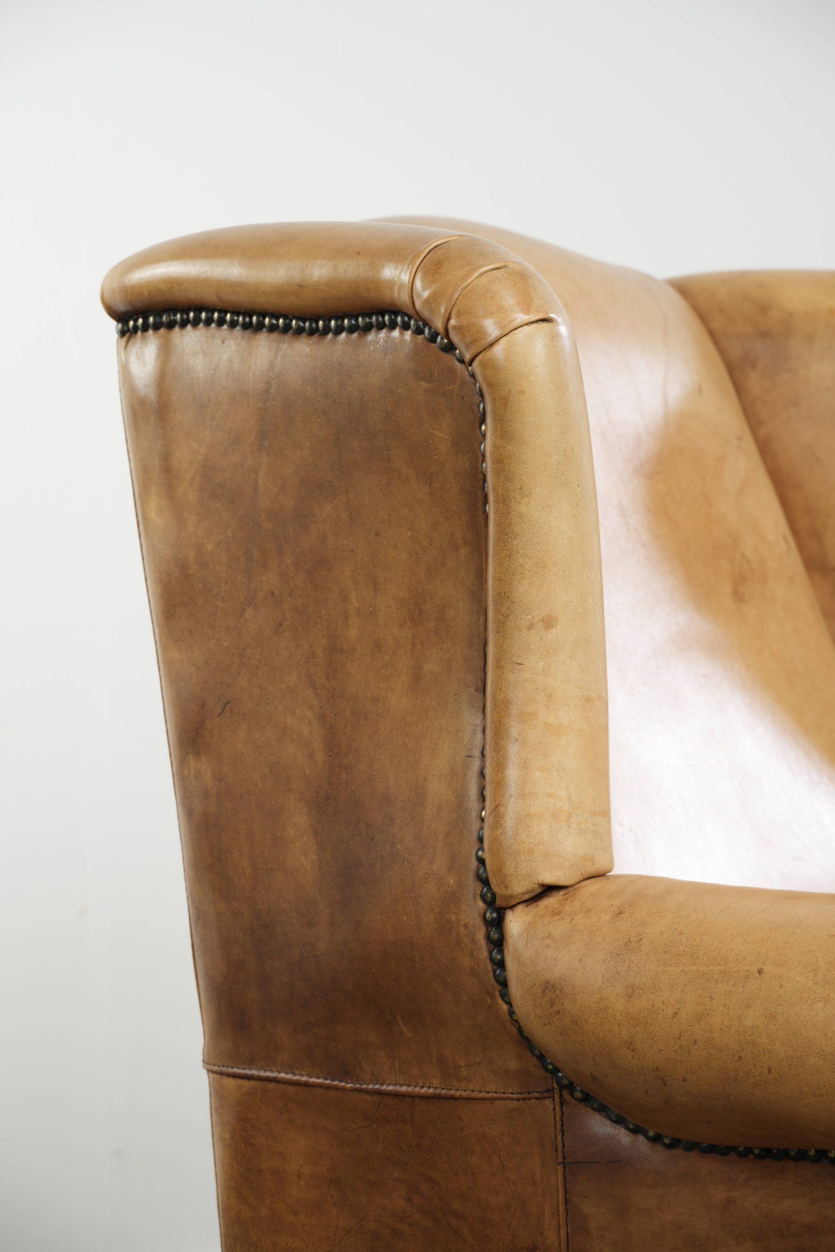 Cow leather wingback armchair with a beautiful timeless English look