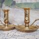 Pair of brass cellar rat candlesticks