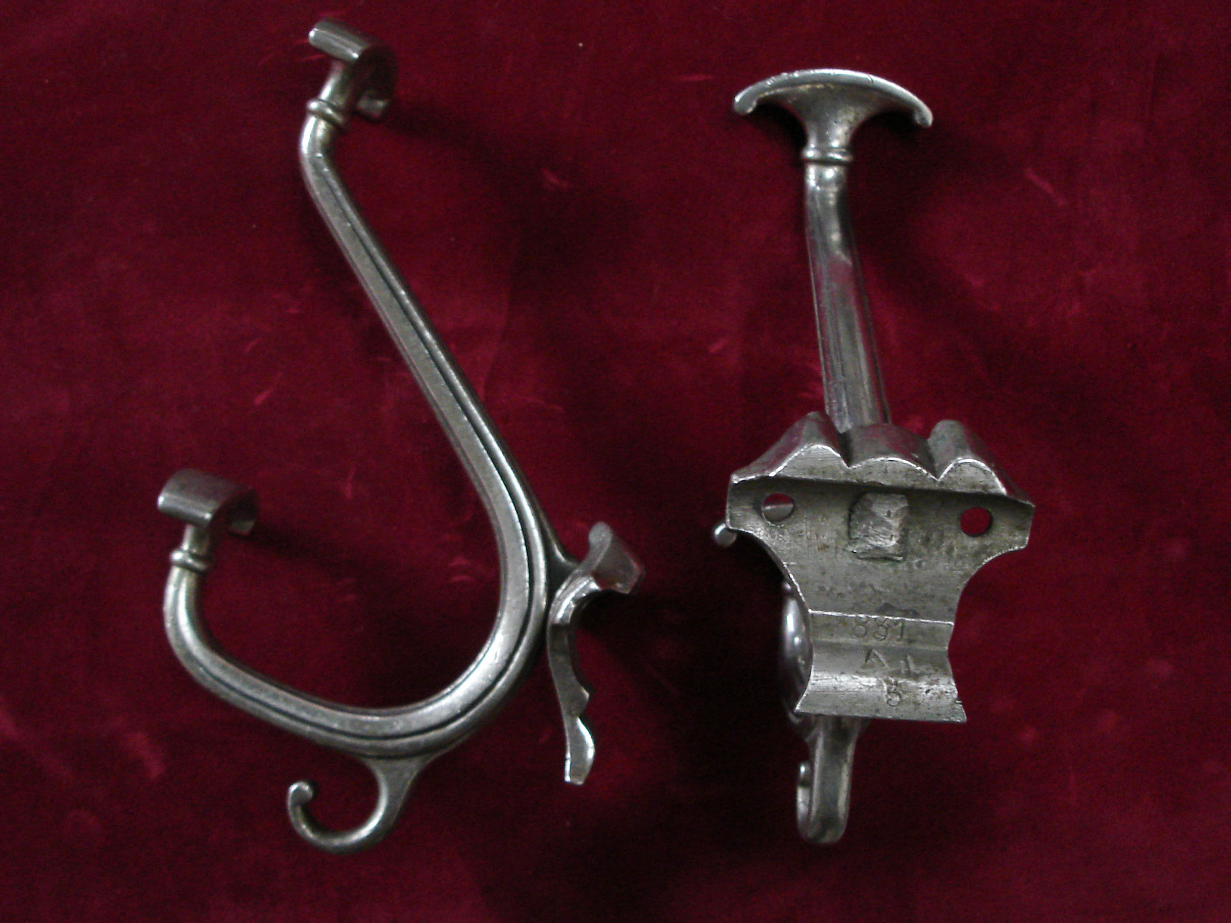 Pair of silver metal hooks