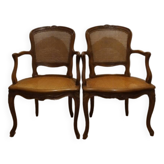 Pair of André Mailfert cane armchairs