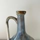 Cherry-decorated earthenware carafe