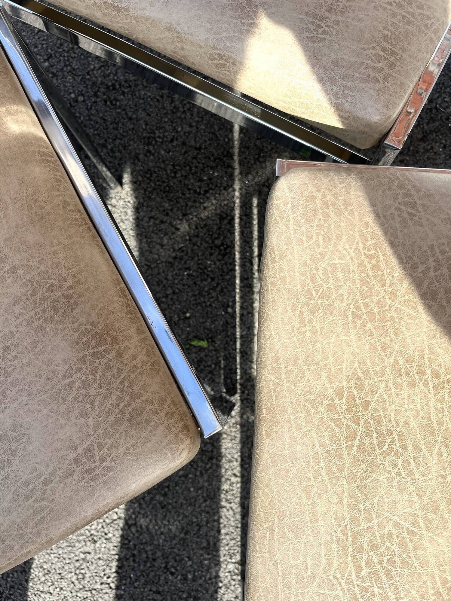 Set of 4 vintage chairs in chrome and faux leather.