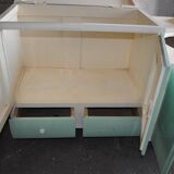 Art Deco washbasin furniture in green and white wood with a glass top, storage from the 1930s.