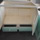Meuble de lavabo Art Déco bois vert et blanc avec plateau verre, rangement années 1930
