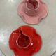 Set of ceramic artisan mugs with poppy red water lily design.
