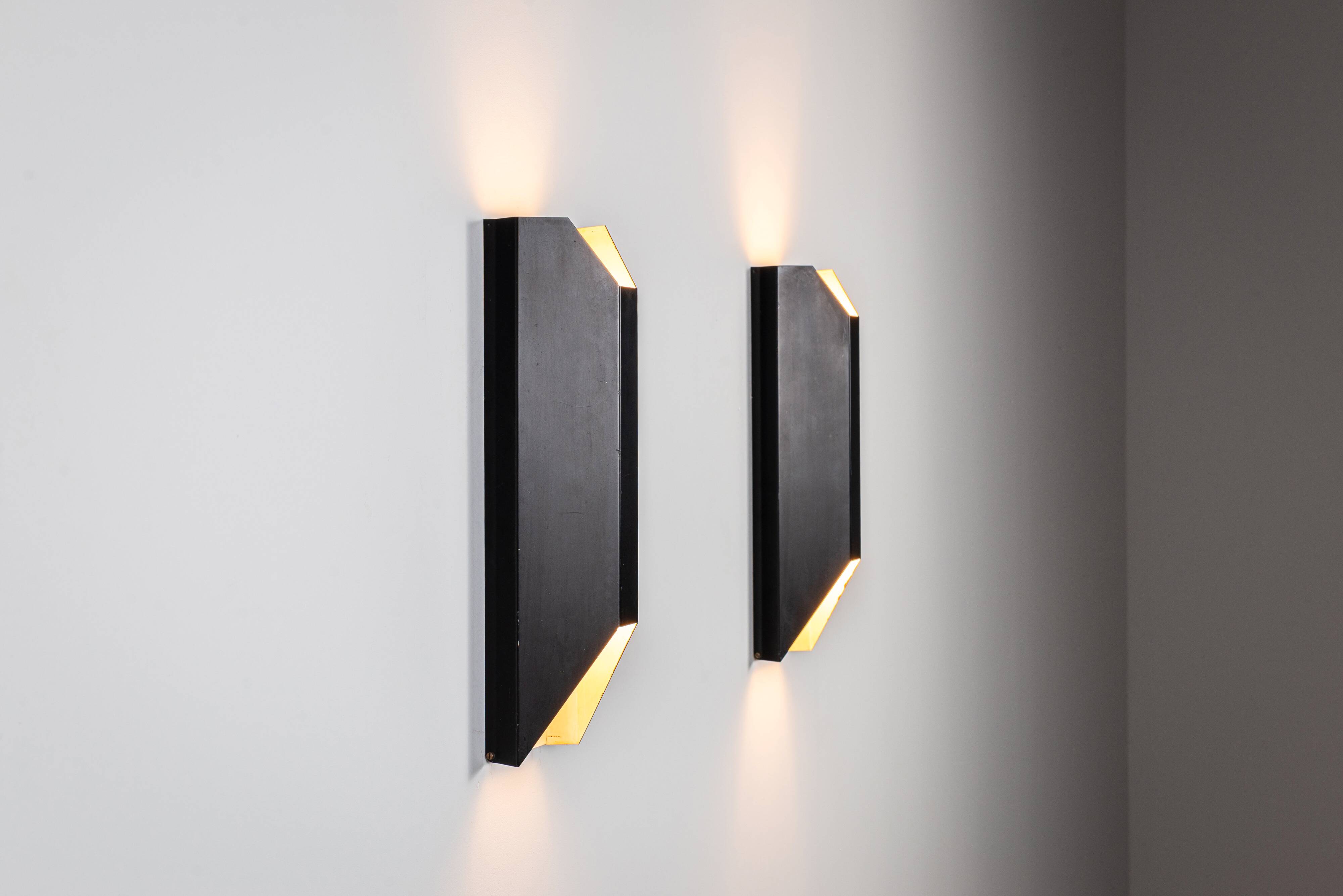 Architectural pair of vintage black metal wall lamps with angular geometric