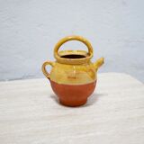 Old gargoulette pot in glazed terracotta