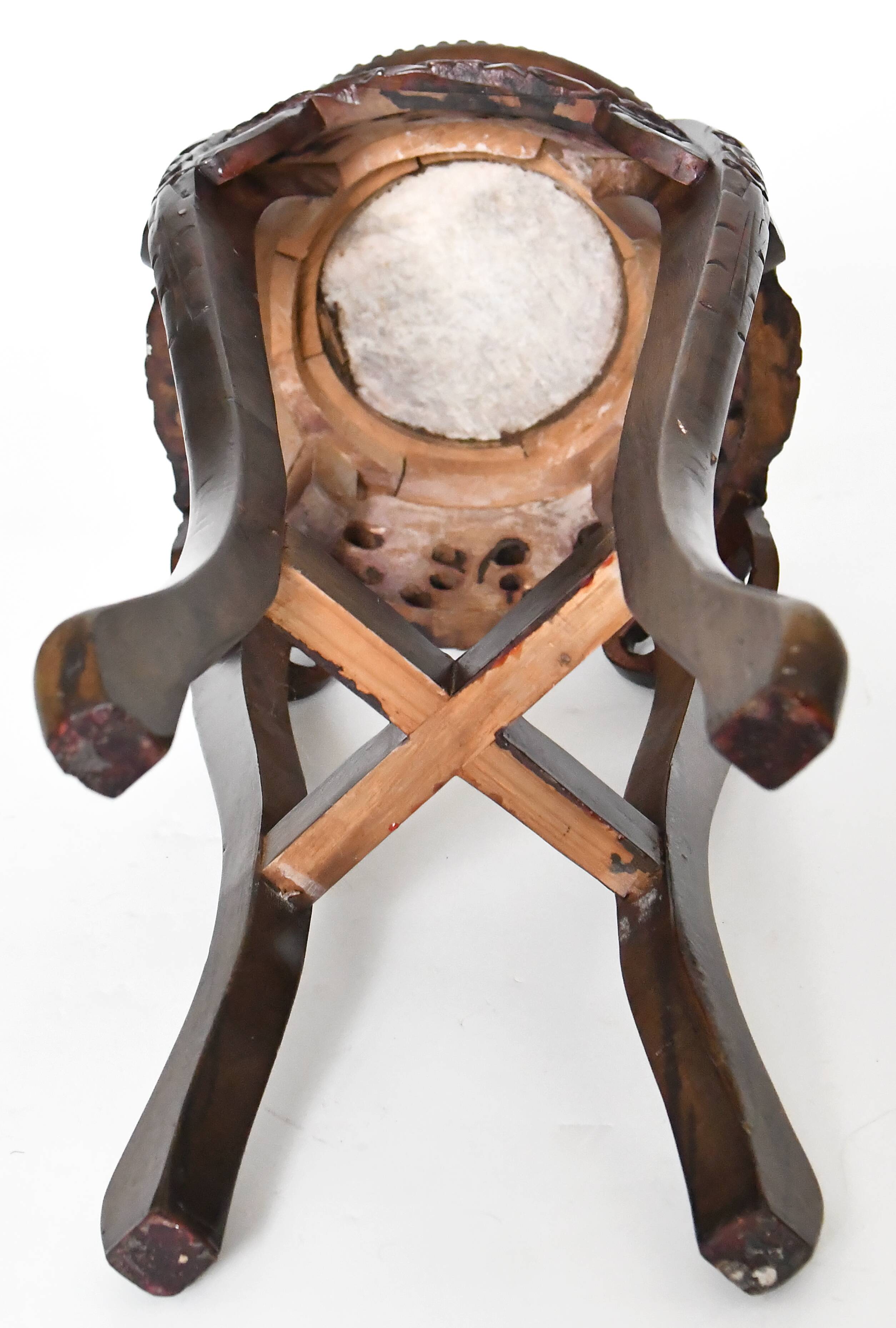 Chinese harness in richly carved wood and marble top