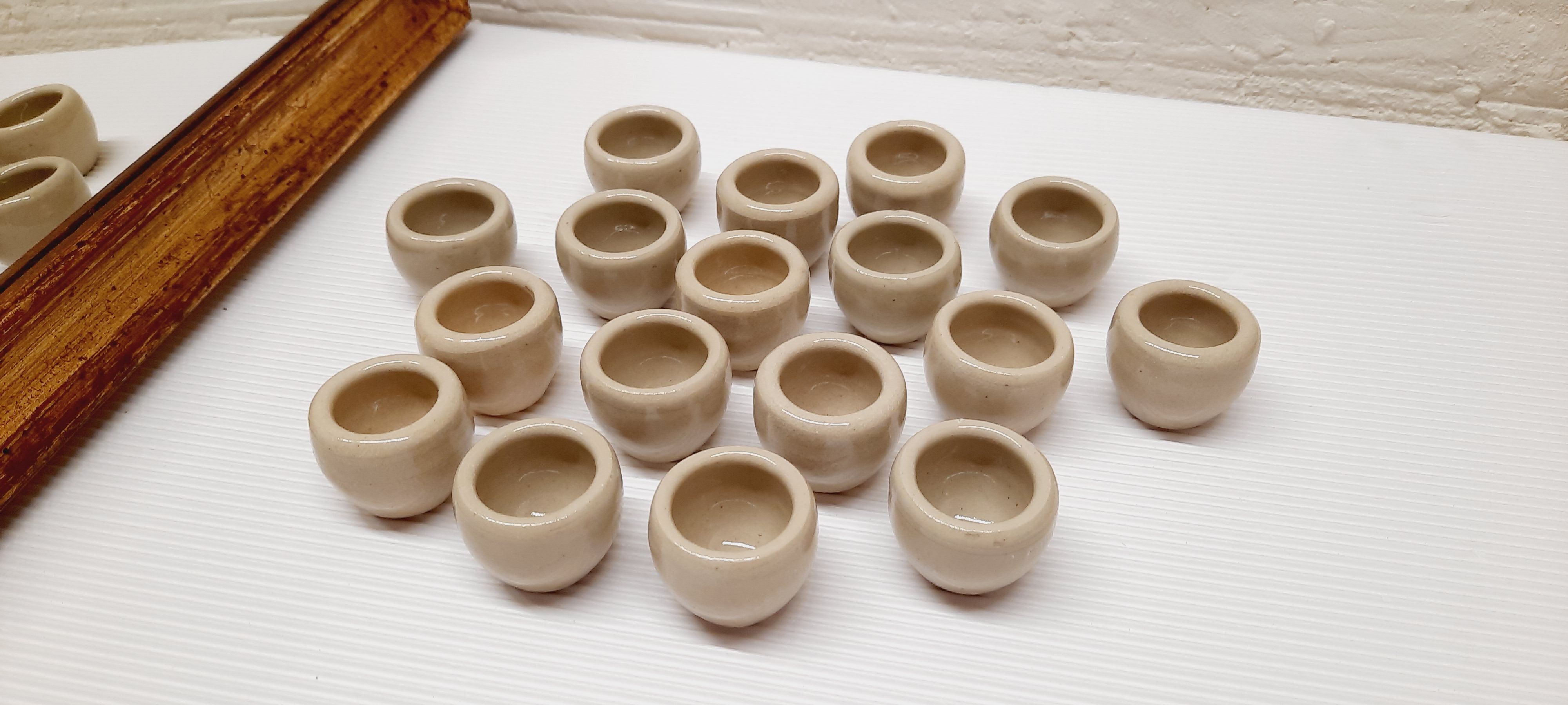 Set of 17 buckets sandstone snails