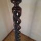 Sculptural floor lamp made of twisted turned wood.
