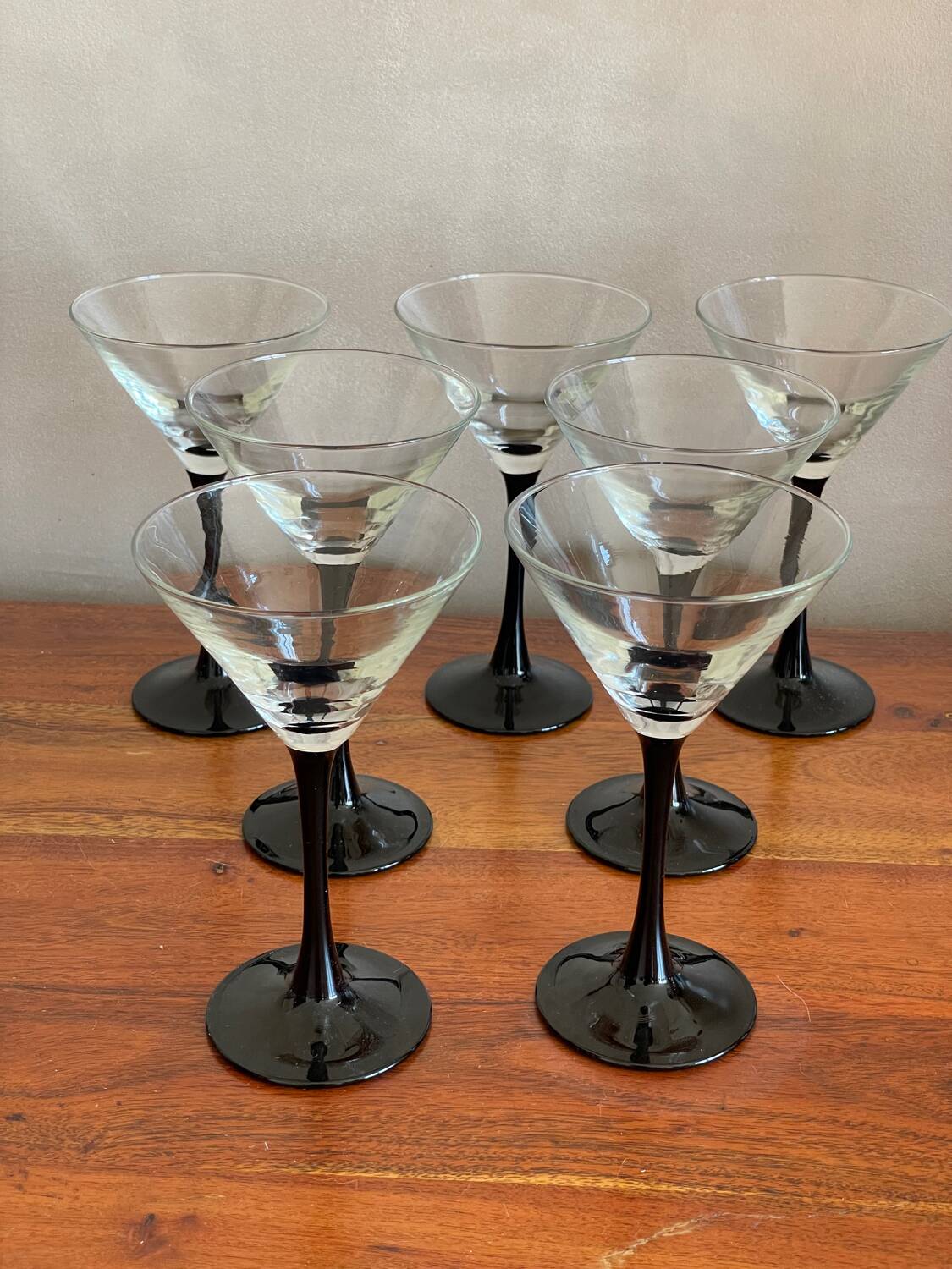 7 thin black stemmed glasses