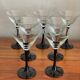 7 thin black stemmed glasses