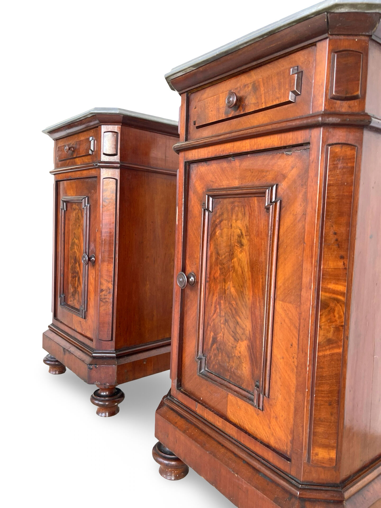 A pair of antique walnut bedside tables from the 1890s.