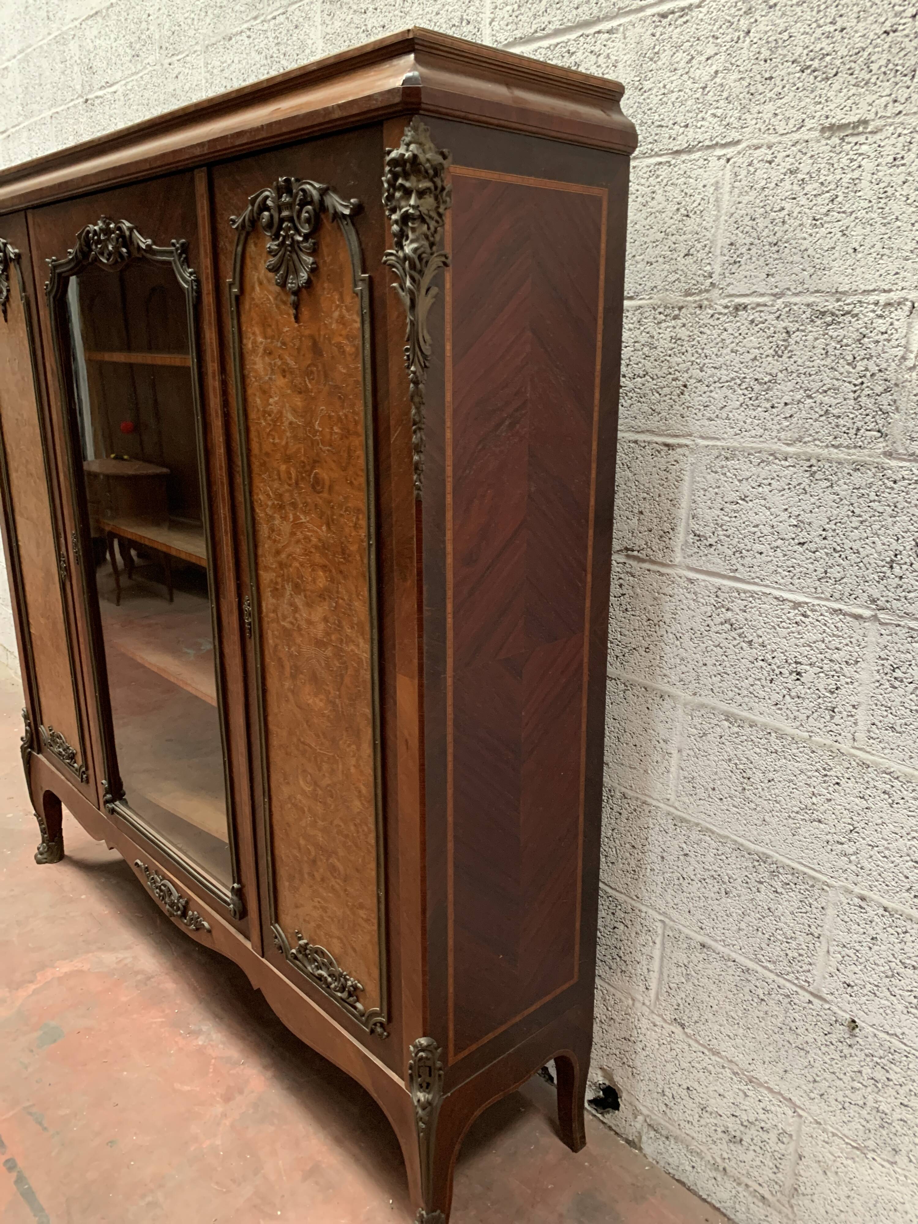 Louis XV style bookcase in mahogany and burr walnut, 20th century