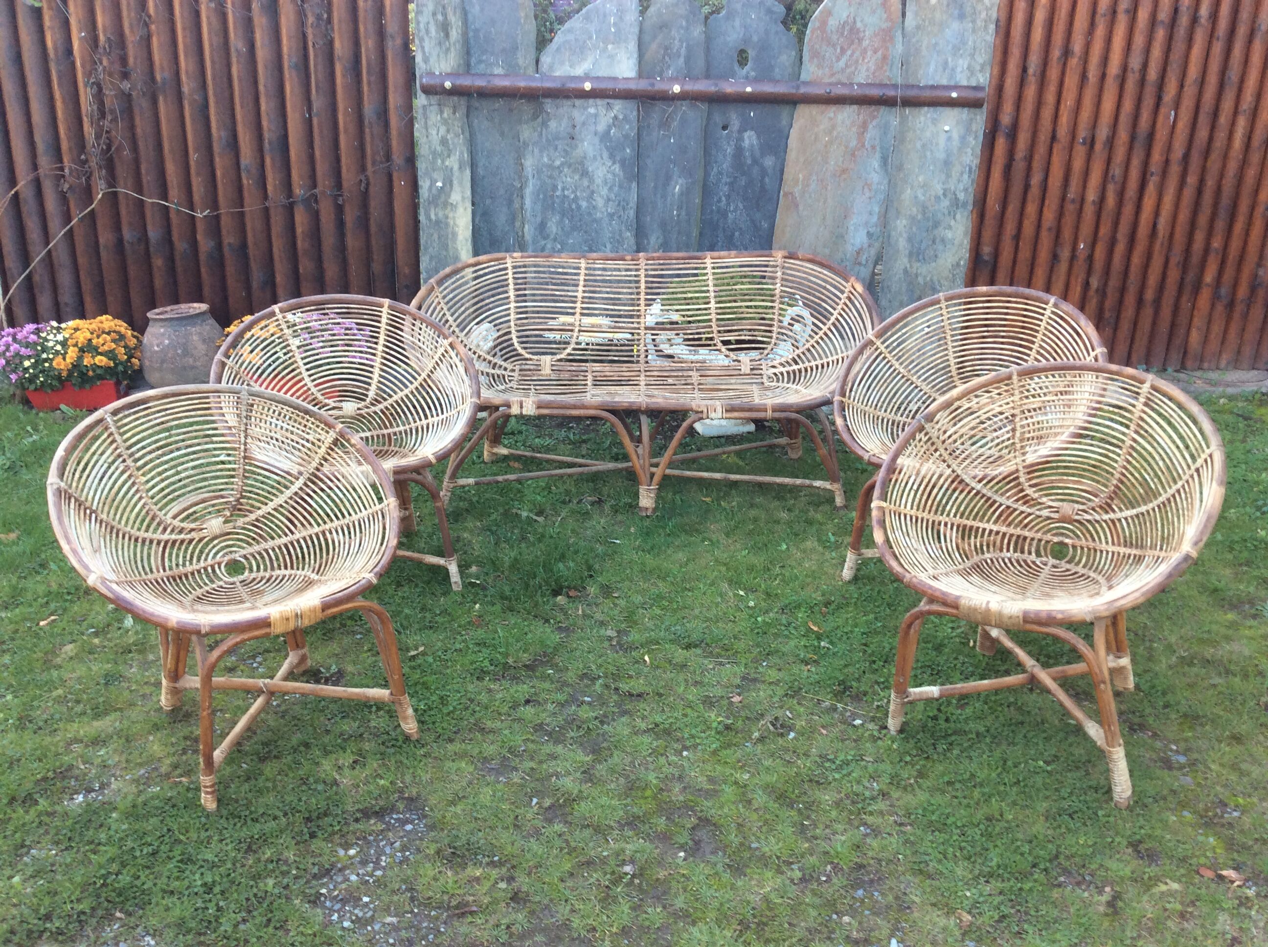 Set of 4 armchairs and 1 vintage rattan bench (5 pieces) inseparable.