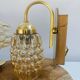 Pair of wall lights in brass and moulded bubble glass, style Helena Tynell.