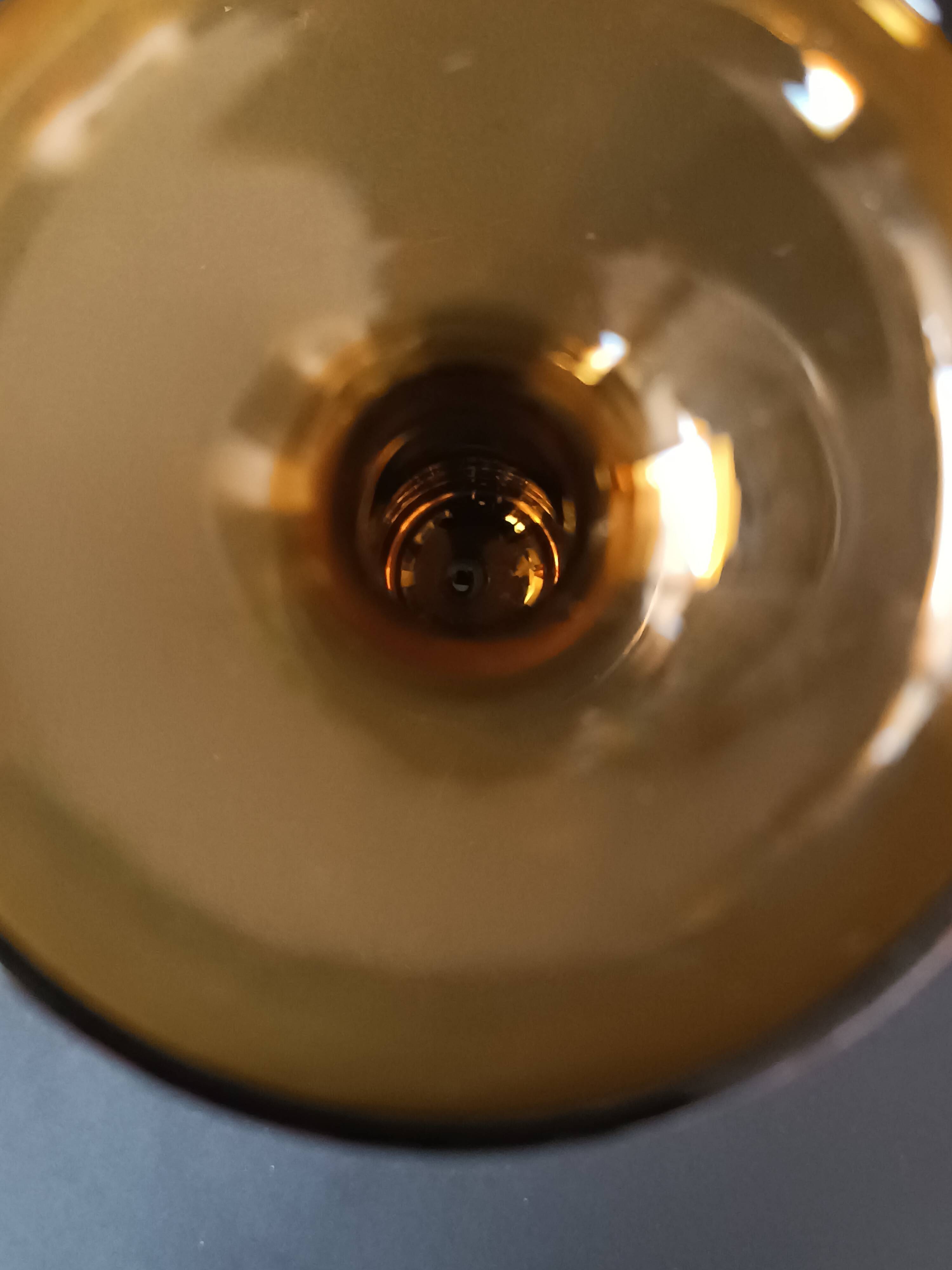 Two vintage Scandinavian double-layered amber blown glass candlesticks