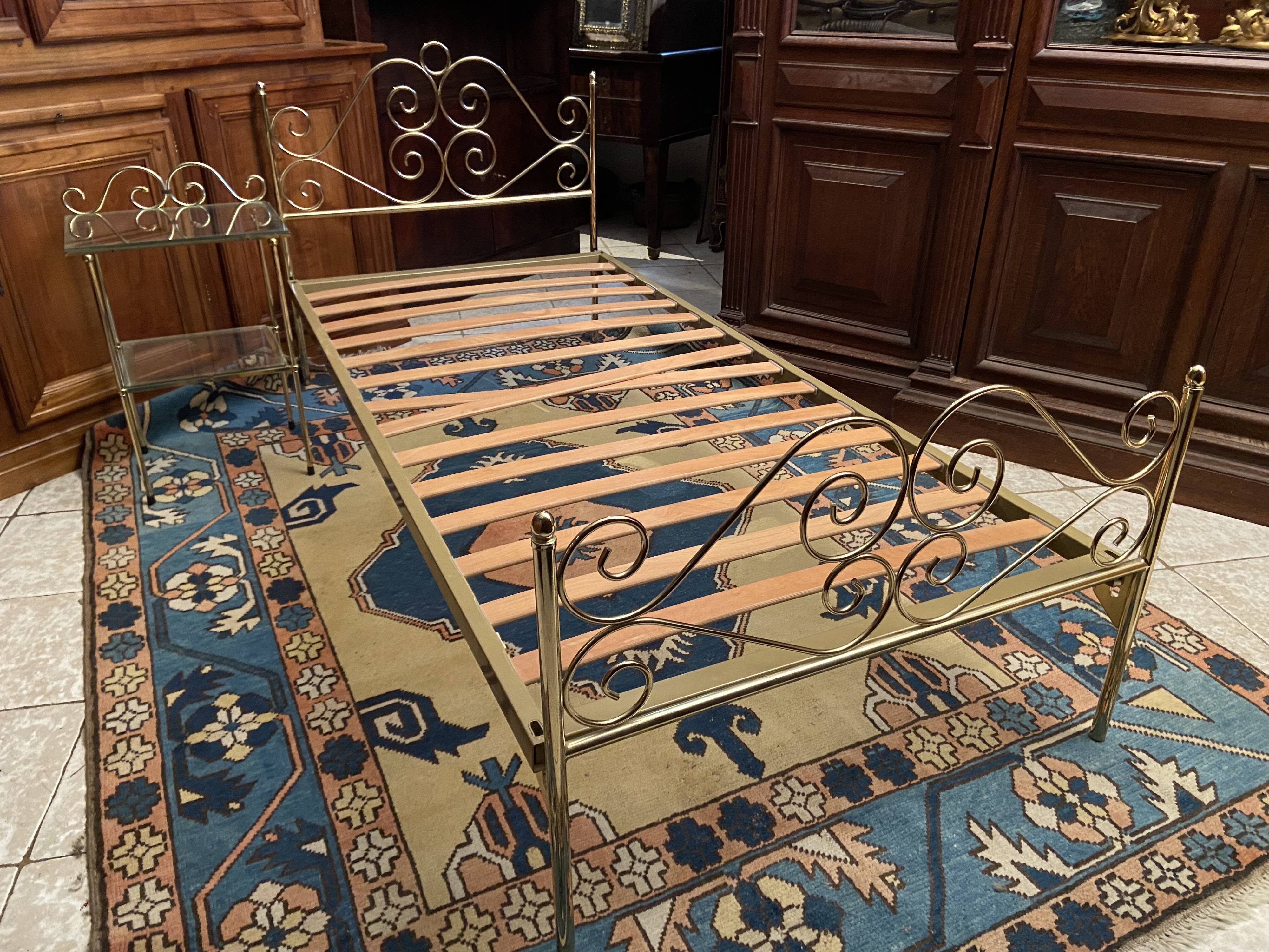 Romantic style single bed in brass with bedside table