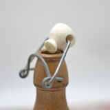 Small wooden sandstone bottle