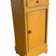 Yellow painted wooden bedside table