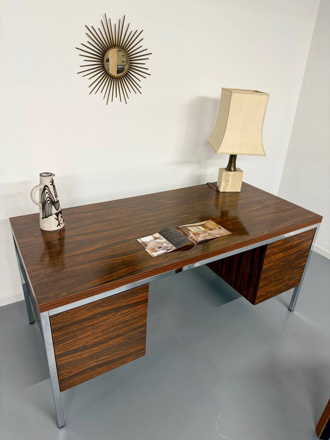 Vintage desk with rosewood veneer and chrome metal design from the 1970s.