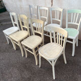 Set of 8 mismatched white bistro chairs