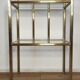 Bedside table in brass and glass.