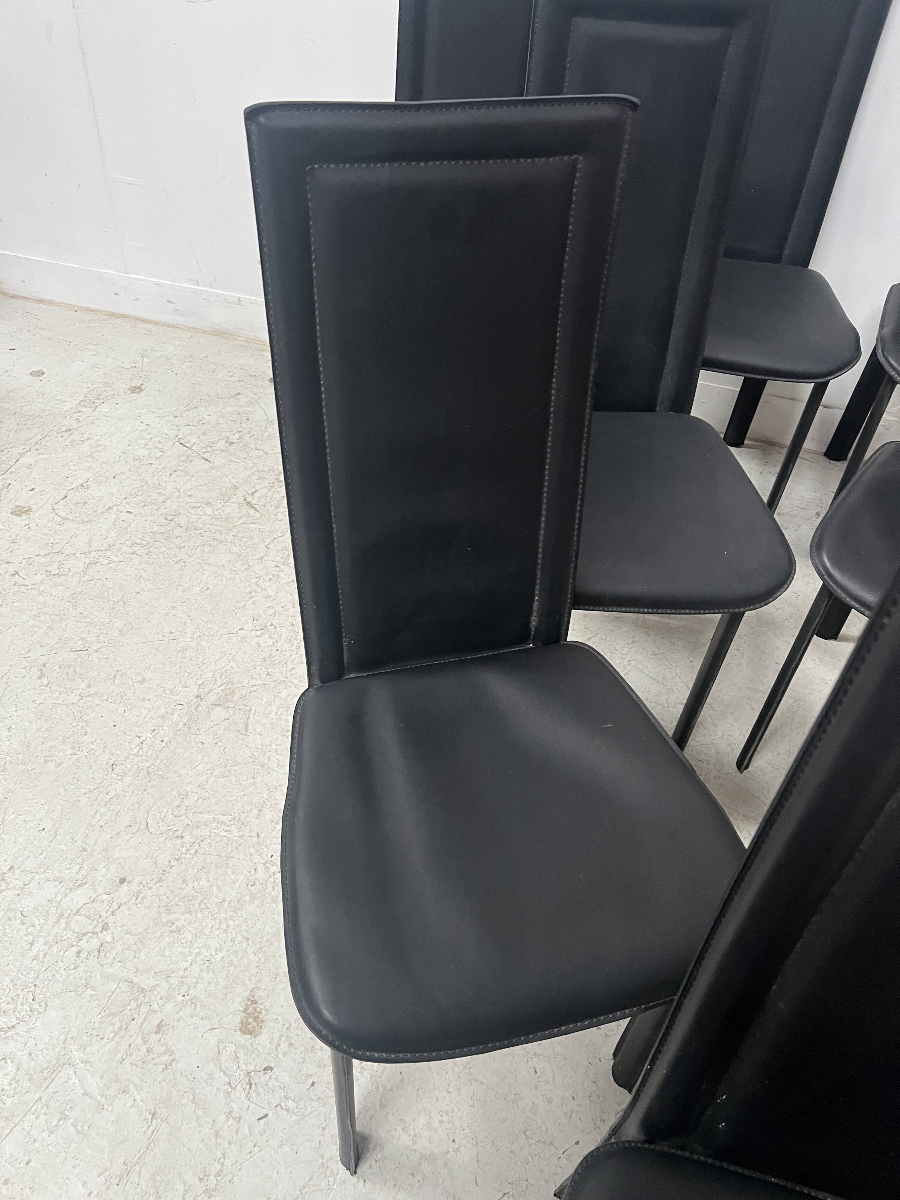 Set of eight designer chairs in black leather from the 20th century