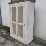 Old rustic Parisian wardrobe patinated in oak and fir