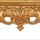 Console with a gilded wood mirror in Rococo style.