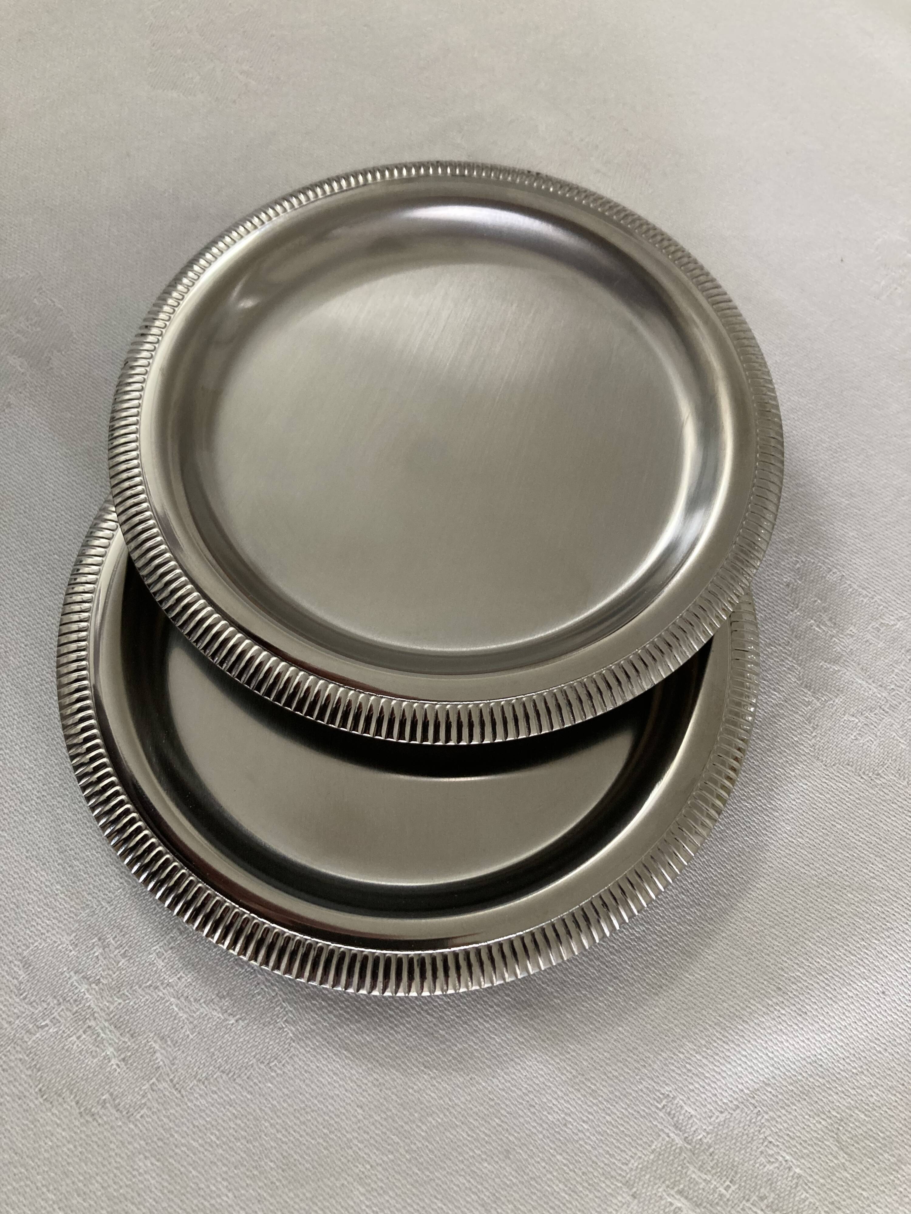 Pair of stainless steel bottle coasters létang and rémy