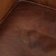 Subtle dark brown sheepskin wingback armchair with a timeless look subtle