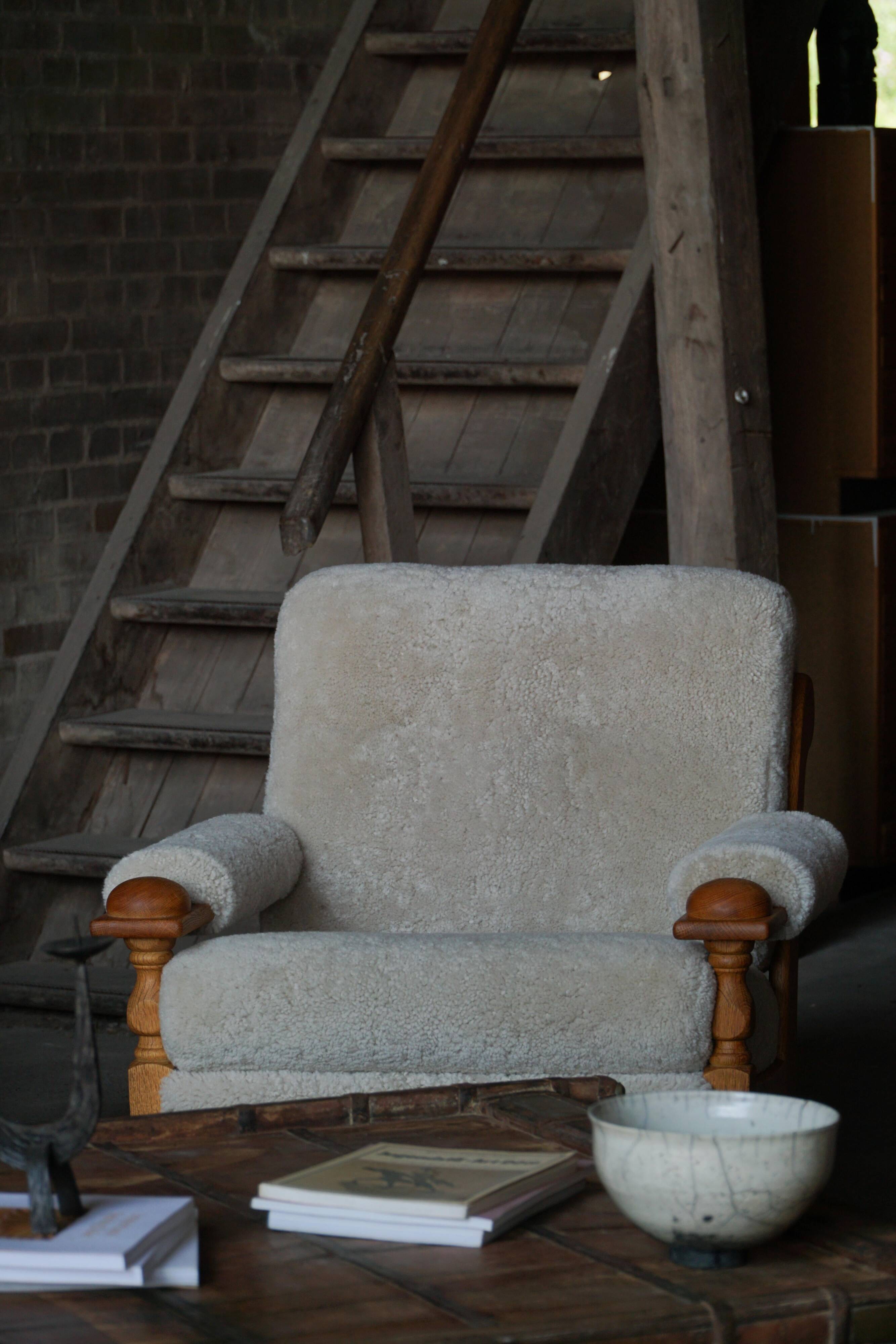 Henning Kjærnulf, lounge chairs in oak and lambswool, mid-century Danish, 1960s.