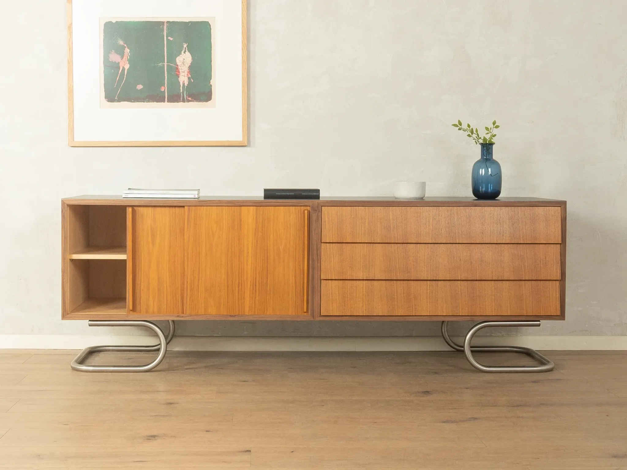 Striking mid-century sideboard with stainless steel base
