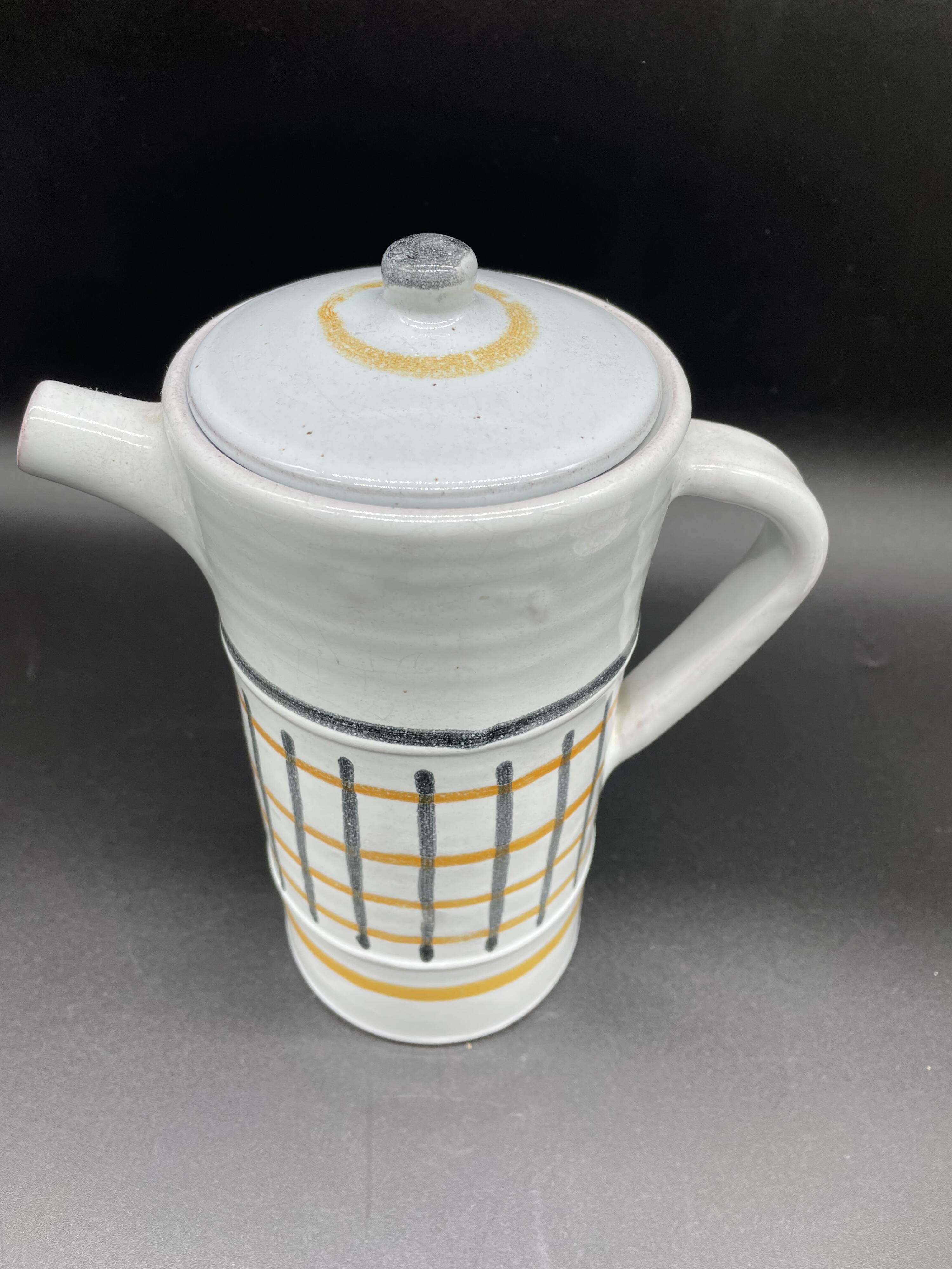 Vintage 1960s coffee service in ceramic, modernist design.