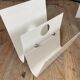 White lacquered metal magazine rack from the 1970s