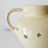 Vintage butter yellow ceramic pitcher in rustic style