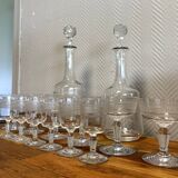Engraved crystal service including 12 glasses and 2 carafes