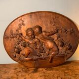 Bas relief en bois sculpté