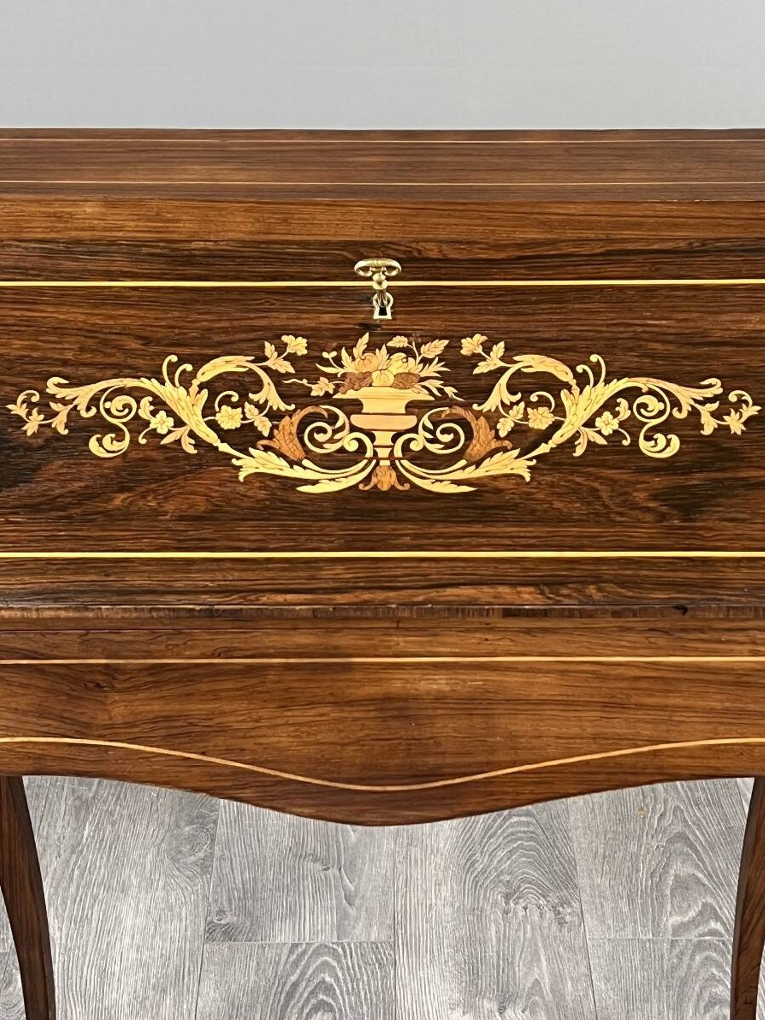 Secretary with a drop-down front in marquetry, Louis XV style, 19th century.
