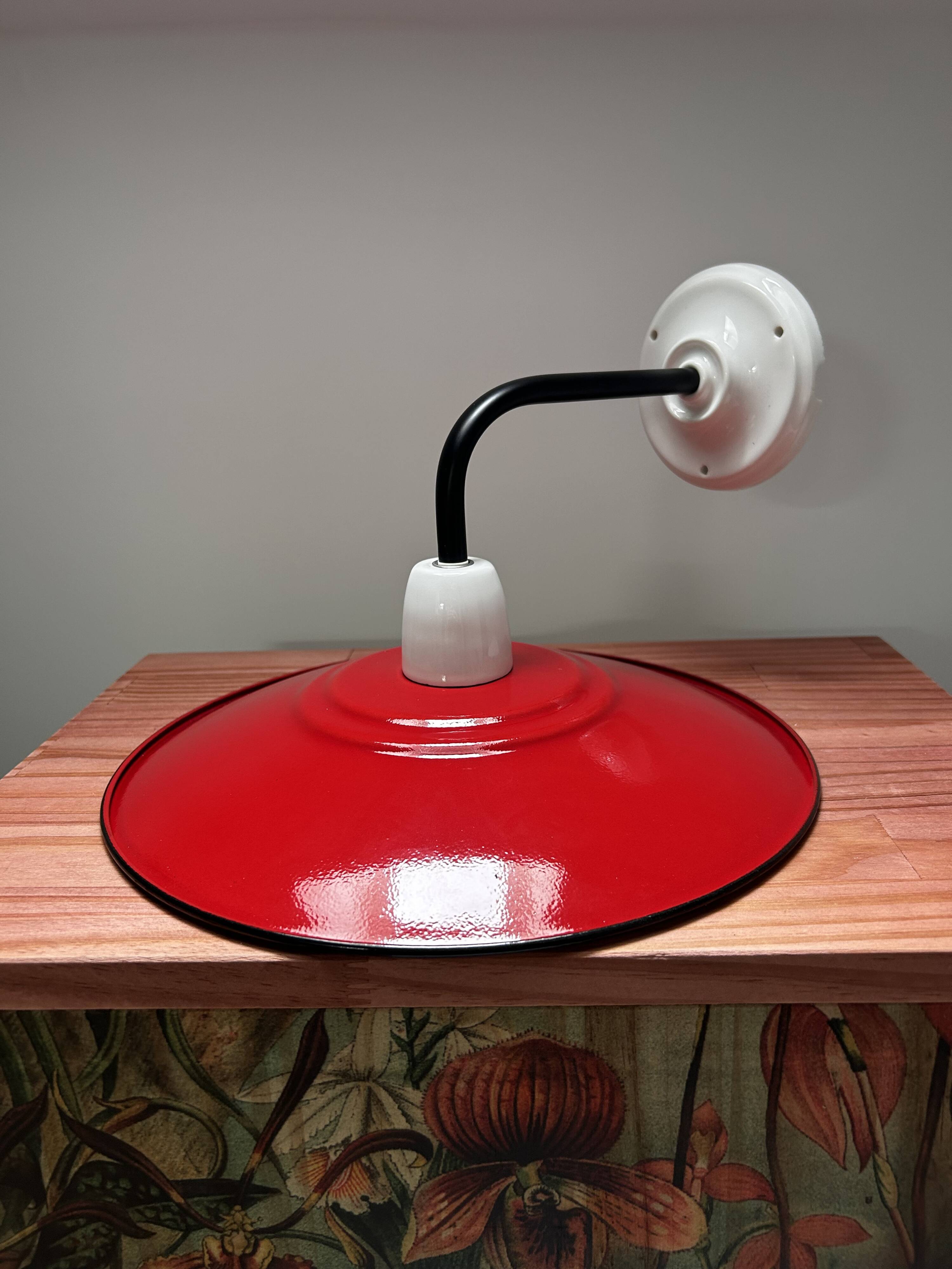 Red enamelled sheet metal wall light
