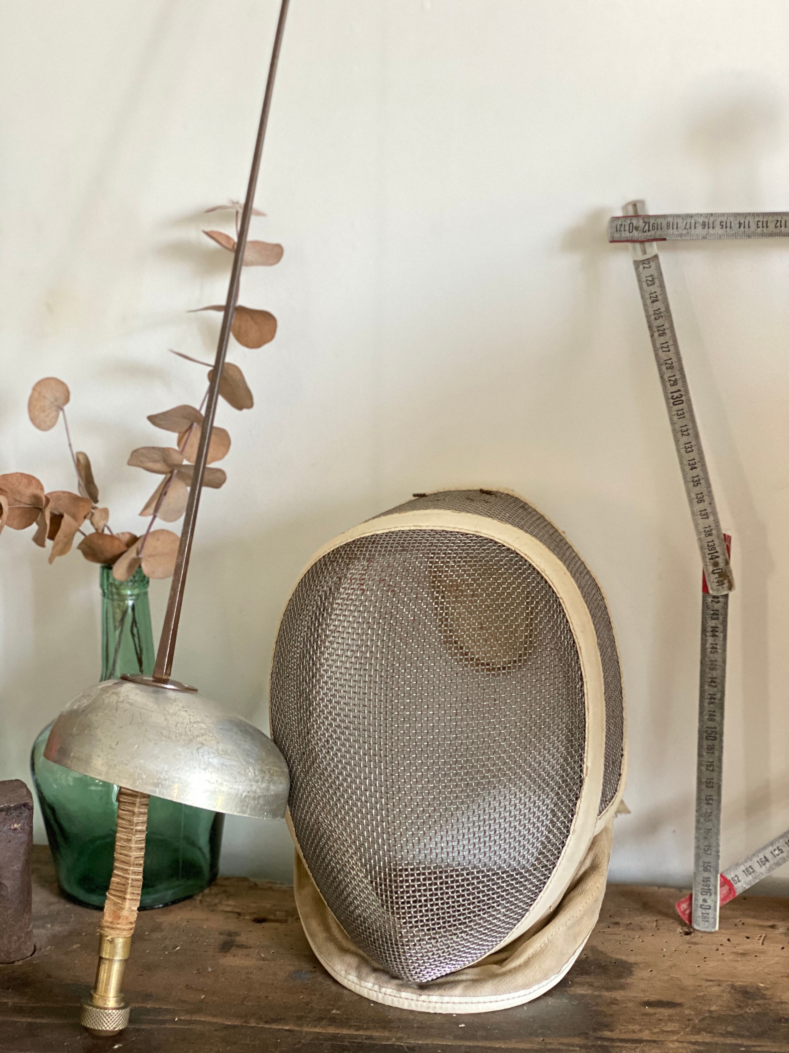 Old fencing mask set and its foil