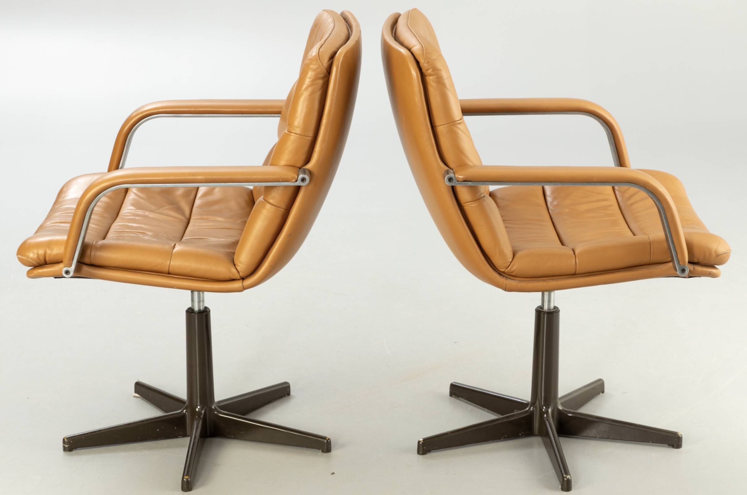 Pair of swivel armchairs by Geoffrey Harcourt.