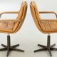 Pair of swivel armchairs by Geoffrey Harcourt.