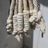 Hanging plant holders in macramé and rattan