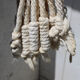 Hanging plant holders in macramé and rattan