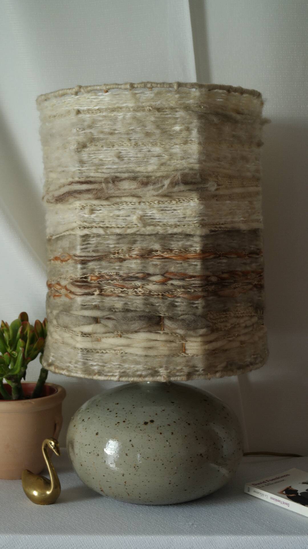 Vintage ceramic lamp with a wool shade.