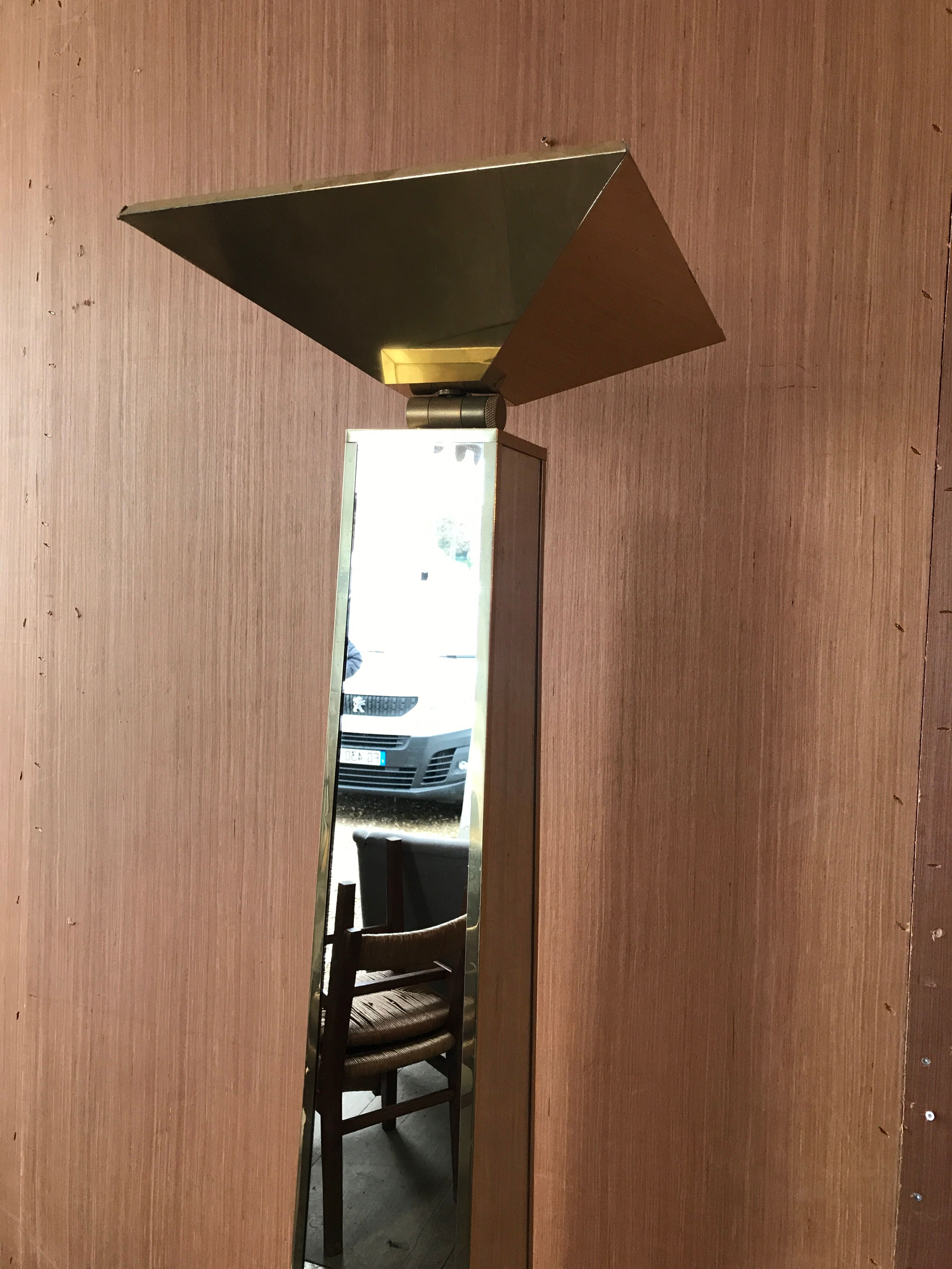 Mirror and gold metal lamppost