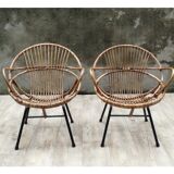 Pair of rattan shell chairs with metallic feet