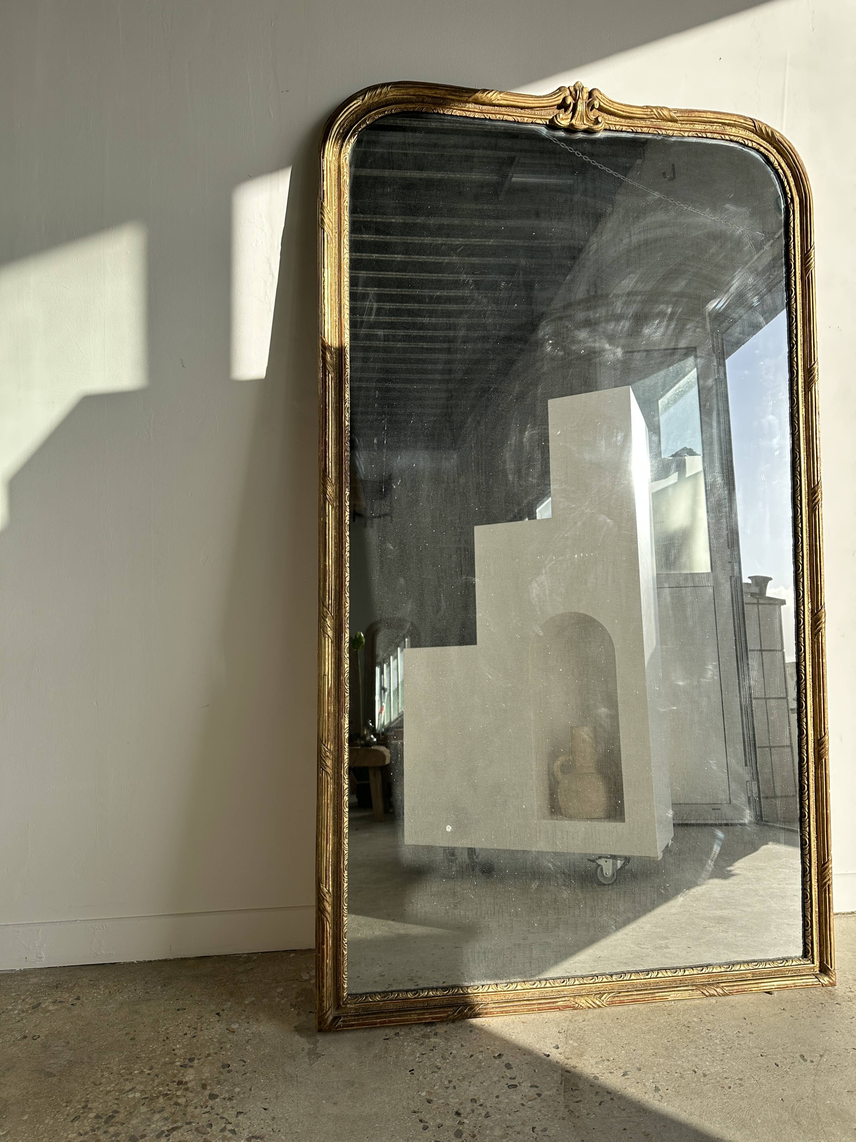 Large gilded mirror 19th century rounded corners mercury glass Louis XVI style